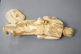 A Japanese ivory okimono, early 20th century, detached from signed base. 19cm